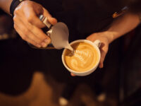 Barista at work in a coffee shop. Preparation service concept. Top view